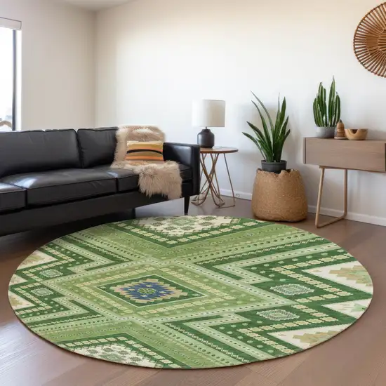 8' Green Navy Blue And Ivory Tribal Washable Round Rug With UV Protection Photo 4