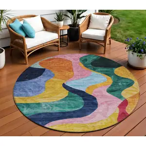 Photo of 8' Green Orange And Pink Round Abstract Washable Indoor Outdoor Area Rug