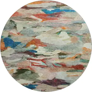 Photo of 8' Green Orange And Teal Abstract Washable Round Rug With UV Protection