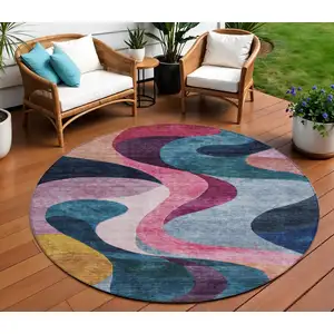 Photo of 8' Green Pink And Teal Blue Round Abstract Washable Indoor Outdoor Area Rug