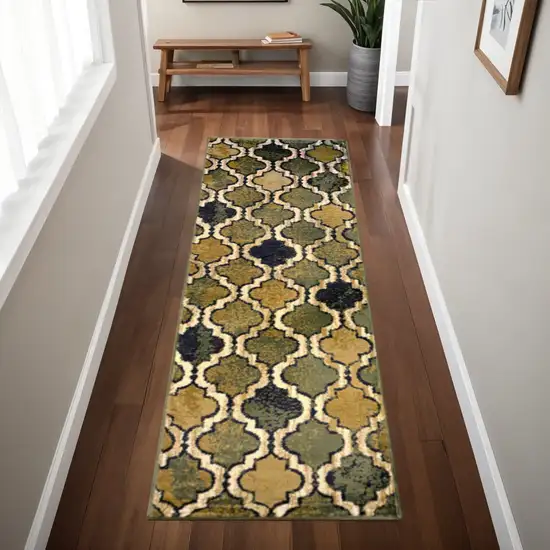 8' Green Brown And Ivory Quatrefoil Distressed Runner Rug Photo 1