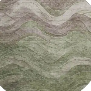 Photo of 8' Green Taupe And Beige Abstract Washable Round Rug With UV Protection