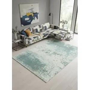 Photo of 8' Green White And Gray Abstract Washable Round Rug With UV Protection