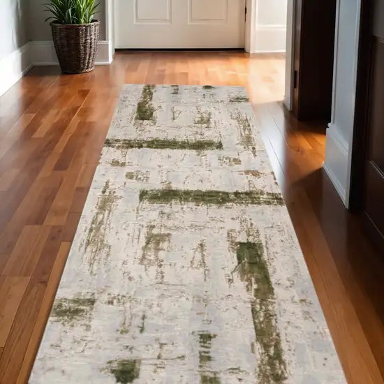 13' Green and Ivory Abstract Power Loom Distressed Runner Rug Photo 1