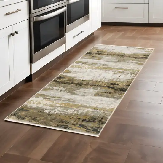 8' Grey Gold Black Charcoal And Beige Abstract Power Loom Runner Rug With Fringe Photo 1