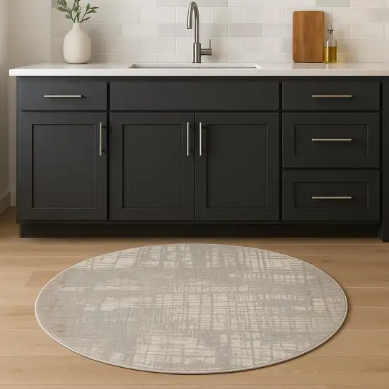 4' Ivory Abstract Power Loom Round Rug Photo 1