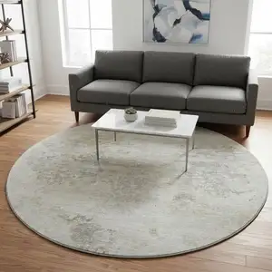 Photo of 8' Ivory And Beige Abstract Washable Round Rug With UV Protection