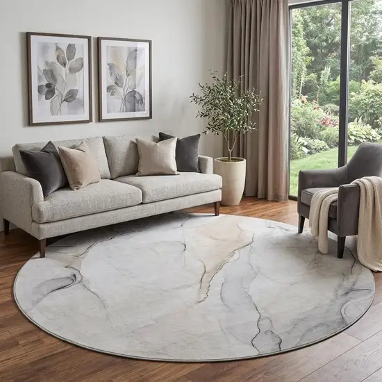 8' Ivory And Beige Abstract Washable Round Rug With UV Protection Photo 1
