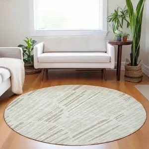 Photo of 8' Ivory And Beige Abstract Washable Round Rug With UV Protection