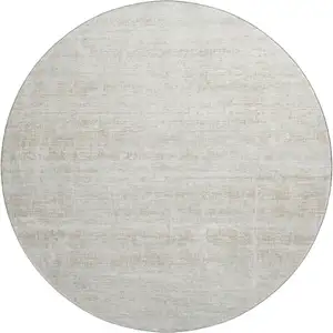 Photo of 8' Ivory And Beige Abstract Washable Round Rug With UV Protection