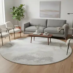 Photo of 8' Ivory And Beige Abstract Washable Round Rug With UV Protection