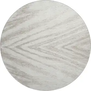 Photo of 8' Ivory And Beige Abstract Washable Round Rug With UV Protection