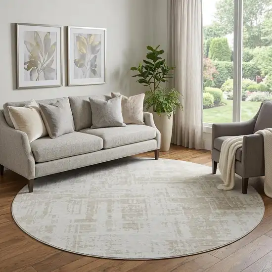 8' Ivory And Beige Abstract Washable Round Rug With UV Protection Photo 1