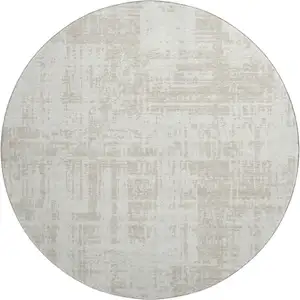 Photo of 8' Ivory And Beige Abstract Washable Round Rug With UV Protection