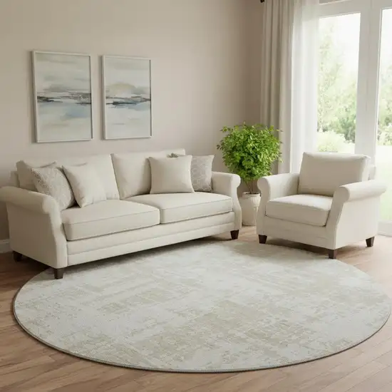 8' Ivory And Beige Abstract Washable Round Rug With UV Protection Photo 1