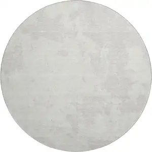 Photo of 8' Ivory And Beige Abstract Washable Round Rug With UV Protection