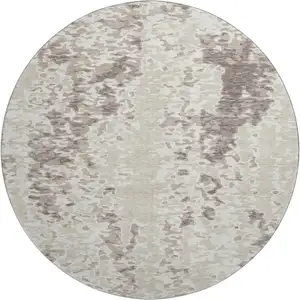 Photo of 8' Ivory And Beige Abstract Washable Round Rug With UV Protection