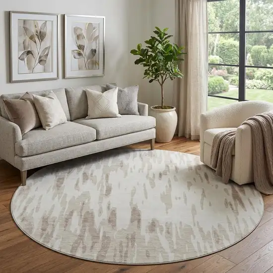 8' Ivory And Beige Abstract Washable Round Rug With UV Protection Photo 1