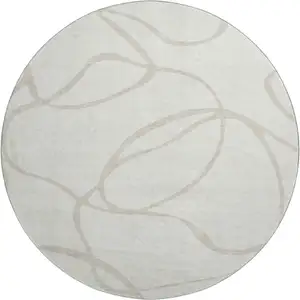 Photo of 8' Ivory And Beige Abstract Washable Round Rug With UV Protection