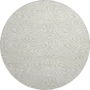 Photo of 8' Ivory And Beige Abstract Washable Round Rug With UV Protection