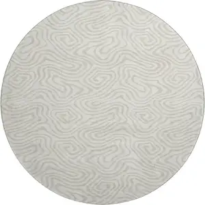 Photo of 8' Ivory And Beige Abstract Washable Round Rug With UV Protection