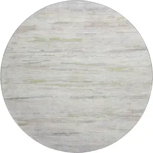 Photo of 8' Ivory And Beige Abstract Washable Round Rug With UV Protection