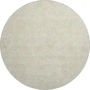 Photo of 8' Ivory And Beige Floral Washable Round Rug With UV Protection