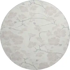 Photo of 8' Ivory And Beige Floral Washable Round Rug With UV Protection