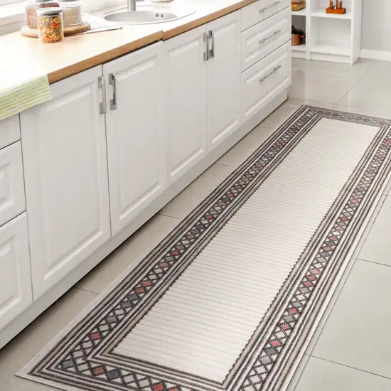 8' Ivory And Beige Geometric Indoor Outdoor Runner Rug Photo 5