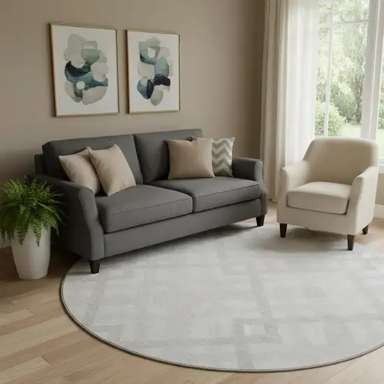 8' Ivory And Beige Geometric Washable Round Rug With UV Protection Photo 1