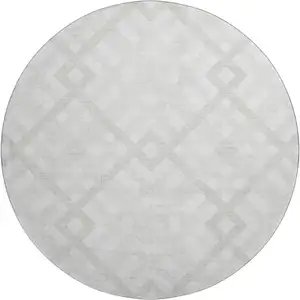 Photo of 8' Ivory And Beige Geometric Washable Round Rug With UV Protection