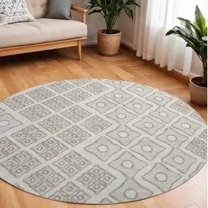 Photo of 8' Ivory And Beige Geometric Washable Round Rug With UV Protection