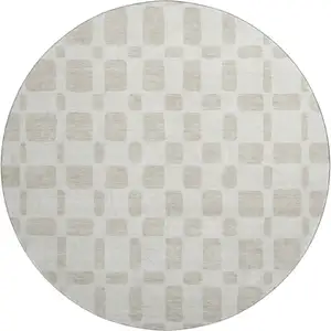 Photo of 8' Ivory And Beige Geometric Washable Round Rug With UV Protection