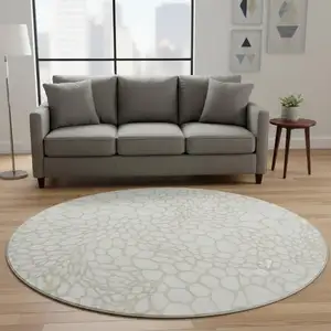 Photo of 8' Ivory And Beige Geometric Washable Round Rug With UV Protection