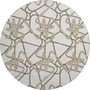 Photo of 8' Ivory And Beige Geometric Washable Round Rug With UV Protection