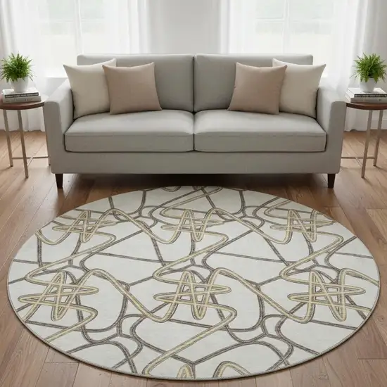 8' Ivory And Beige Geometric Washable Round Rug With UV Protection Photo 2
