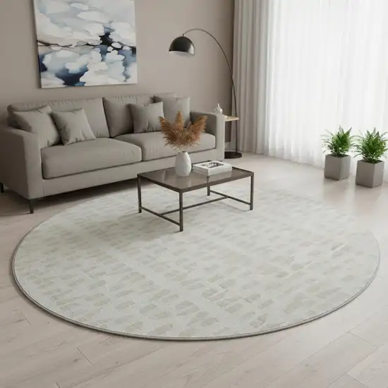 8' Ivory And Beige Geometric Washable Round Rug With UV Protection Photo 2