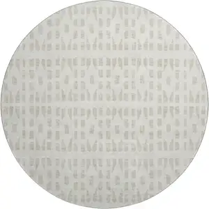 Photo of 8' Ivory And Beige Geometric Washable Round Rug With UV Protection