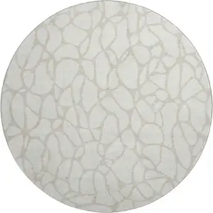 Photo of 8' Ivory And Beige Geometric Washable Round Rug With UV Protection