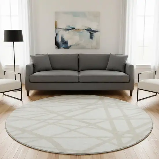 8' Ivory And Beige Geometric Washable Round Rug With UV Protection Photo 2