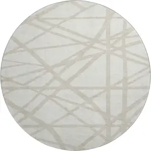 Photo of 8' Ivory And Beige Geometric Washable Round Rug With UV Protection