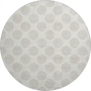 Photo of 8' Ivory And Beige Polka Dot Washable Round Rug With UV Protection