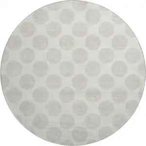 Photo of 8' Ivory And Beige Polka Dot Washable Round Rug With UV Protection