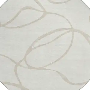 Photo of 8' Ivory And Beige Round Abstract Washable Indoor Outdoor Area Rug