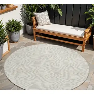 Photo of 8' Ivory And Beige Round Abstract Washable Indoor Outdoor Area Rug
