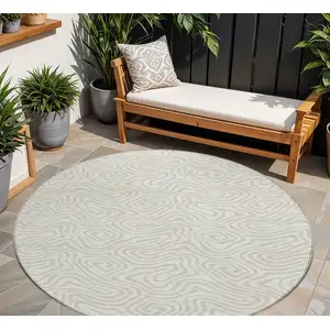 Photo of 8' Ivory And Beige Round Abstract Washable Indoor Outdoor Area Rug