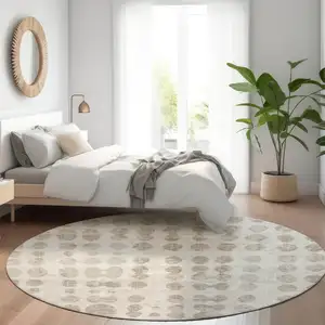 Photo of 8' Ivory And Beige Round Abstract Washable Indoor Outdoor Area Rug
