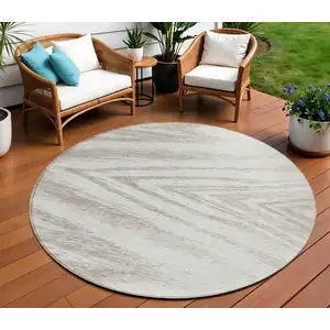 Photo of 8' Ivory And Beige Round Abstract Washable Indoor Outdoor Area Rug