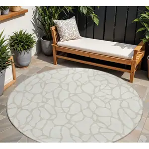 Photo of 8' Ivory And Beige Round Geometric Washable Indoor Outdoor Area Rug