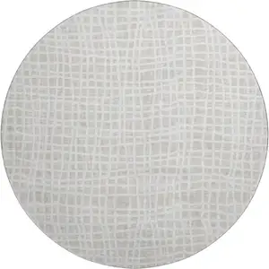 Photo of 8' Ivory And Beige Striped Washable Round Rug With UV Protection